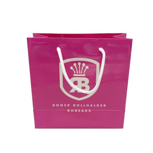 लक्जरी लोगो कस्टम चमकदार गुलाबी उपहार पेपर बैग