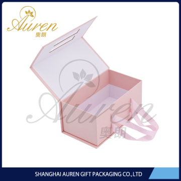 pink paper gift folding box with ribbon