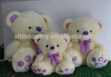 teddy bear with purple/red/pink bowknot