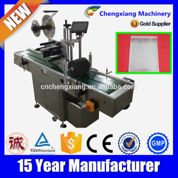 Factory price automatic bag label applicator,plastic bag label applicator,adhesive label machine