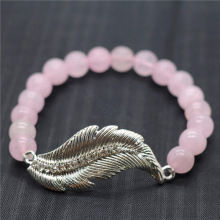 Bracelet de pierres précieuses extensibles de perles rondes de quartz rose 8MM avec pièce en alliage de plumes Diamante
