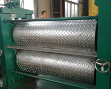 Metal sheet embossing machine