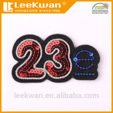 Letter sequin embroidery applique with sew-on backing