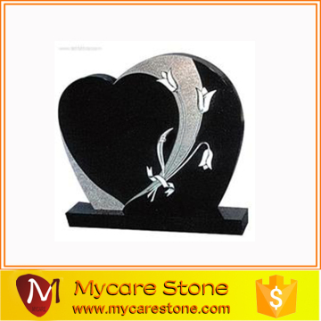 Black hand-carved granite heart shape stone tomb for cemetery