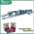 Sistema automatizado de flujo de materiales para la producción de sacos de papel multi-papel