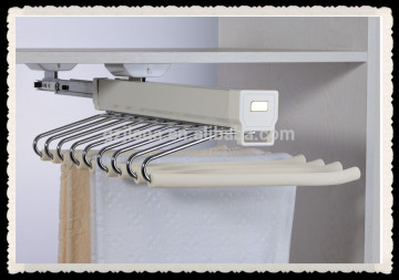 Top mounted pull out trousers rack for wardrobe