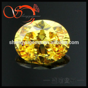 golden yellow machine cut oval cubic zirconia