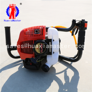 Small backpack core sample drilling machine / handle held backpack rig construction on the hill