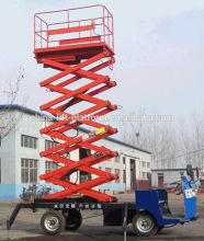 Portable scissor lift vehicle carrying scissor lift