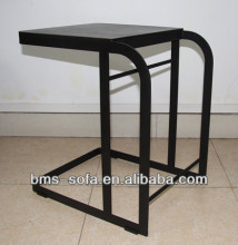 small coffee table beside sofa