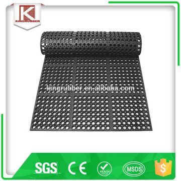Rubber floor matting with surface textures, and large drainage holes