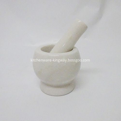 white marble stone mortar and pestle