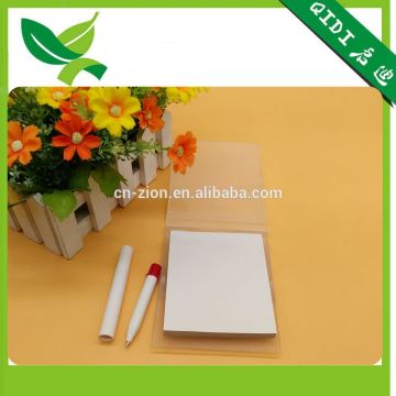 The wooden colorful memo notebok paper with pen