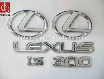 Vacuum coated car emblem/lighted car emblem