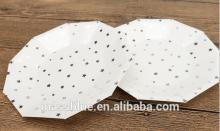White color decagon shape paper plate with many small silver color stars