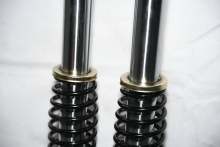 Outer spring spiked 3-wheel shock absorber