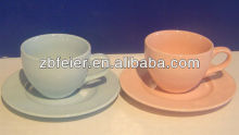 color glazed ceramic cup and saucer