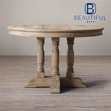 Round solid wood table in natural wood color