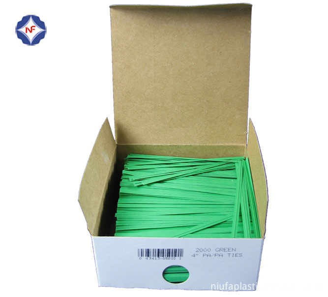 green paper twist tie in box