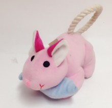 A rabbit shaped toy with a yarn rope.