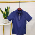 Top a maniche corte a cavallo con zip blu