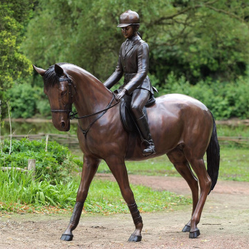 Life size bronze girl with citation horse statue