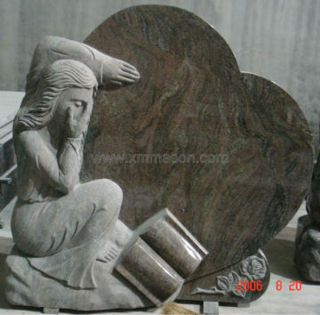 Mason headstone with angel sculpture