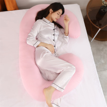 女性は産科妊娠産児枕をサポートしています