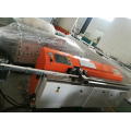 Automatic butyl extruder for spreading aluminum spacer frame