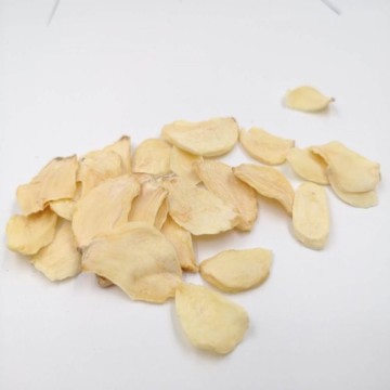 Dehydrated garlic flakes with root