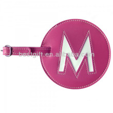 initial centred pink round leather luggage tag