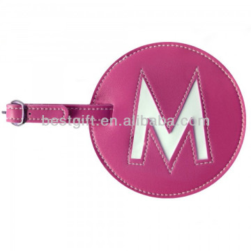 initial centred pink round leather luggage tag