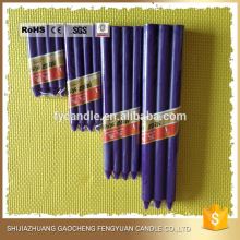 bright colored bees wax taper candle