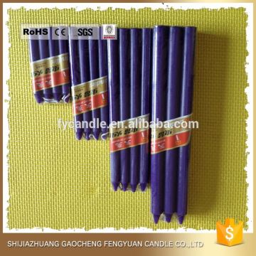 bright colored bees wax taper candle