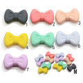 Bowknot in resina con foro da 4 mm Multi colori Accessorio fai da te Papillon artificiale Craft Kids Clothes Ornament