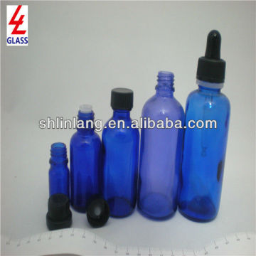 blue glass essential oil bottle