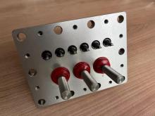 Semi-enclosed compressor seal terminal panel