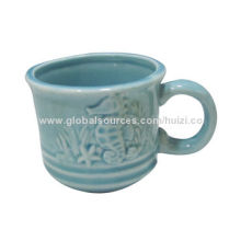 Coloured ceramic mug with embossed design