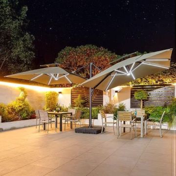 Double headed outdoor sun umbrella