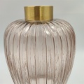 Tall glass vase with ribbed pattern