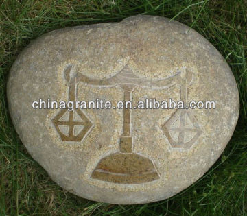 stone sculpture with libra