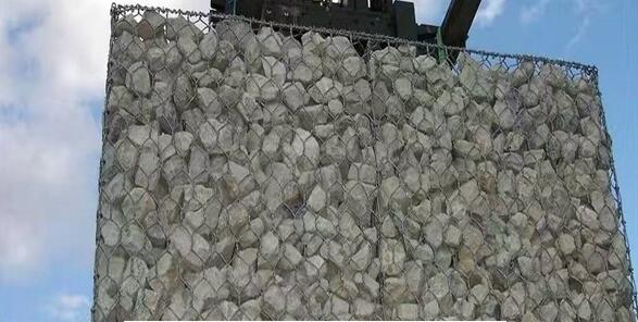 Gabion wall made of stones in the steel mesh