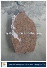 red headstone with rose design