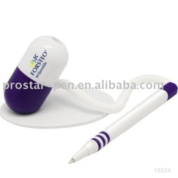 Pill shaped ball pen with pen holder