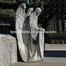 Stone hells angels with big wings statue