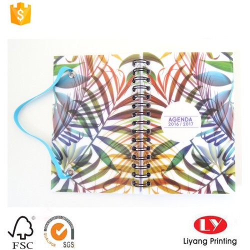 Kawat atau ikat notebook spiral dengan karet gelang