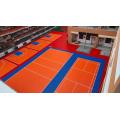 กระเบื้องประสานงานมืออาชีพกลางแจ้งสำหรับสถานที่เล่นกีฬาอเนกประสงค์ PP Flooring