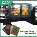 Sistema automatizado de flujo de materiales para la producción de sacos de papel multi-papel