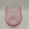 Vaso in vetro colorato rosa soffiato a mano con bordo dorato