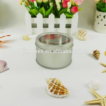 round tin can with clear window